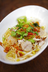 close up thai spicy fish noodle in white cup