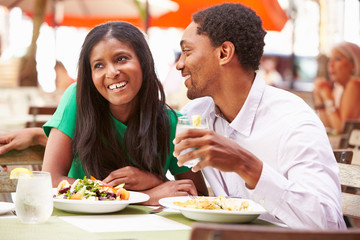 Couple Enjoying Lunch In Outdoor Restaurant