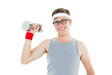 Fototapeta na wymiar Geeky hipster posing in sportswear with dumbbell