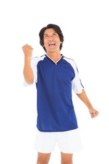 Football player in blue celebrating