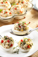 stuffed eggs with ham, red pepper and dill