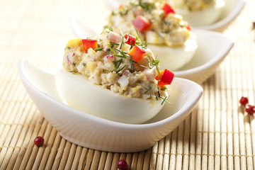 stuffed eggs with ham, red pepper and dill