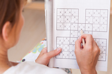 Woman doing crosswords