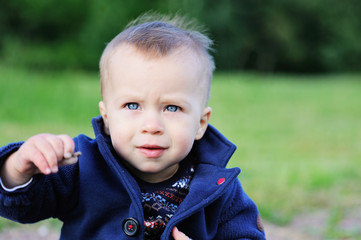 Portrait of adorable blond baby boy