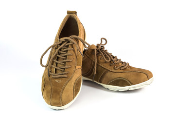 brown suede shoes on white background