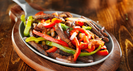 mexican beef fajitas with bell peppers panoramic shot - obrazy, fototapety, plakaty