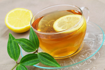Lemon tea and green leaves