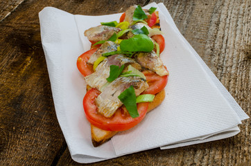 Bruschetta with tomato, sardines