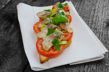 Bruschetta with tomato, sardines
