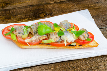 Bruschetta with tomato, sardines