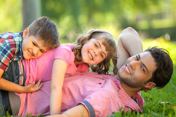 Fototapeta premium Daddy carrying children