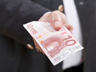 front view of ten euro banknote in male hand