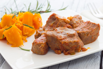 Pork stew garnished with pumpkin