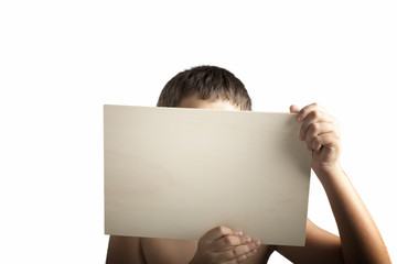 Plywood sign held up by young hands
