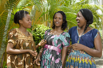 Three Happy African women Chatting Outdoor