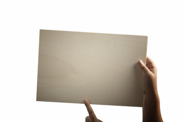 Plywood sign held up by young hands