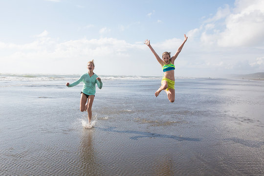 Kids Running And Jumping At The Beach