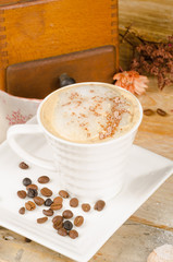 Cappuccino and coffee grinder