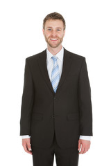 Confident Businessman Standing Over White Background