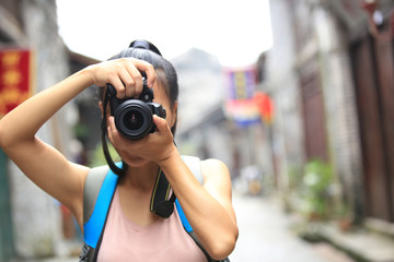 woman photographer taking photo in guilin,china 