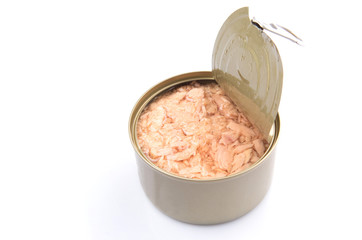 Pieces of tuna fish in a tin can over white background
