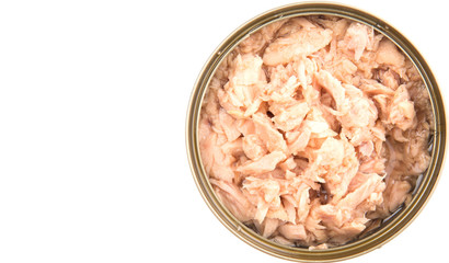 Pieces of tuna fish in a tin can over white background