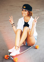 Fashion lifestyle, beautiful young woman with longboard. Lightle