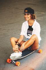 Fashion lifestyle, beautiful young woman with longboard. Lightle