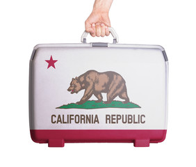 Used plastic suitcase with stains and scratches