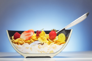 dissected half plate with corn flakes and fruit