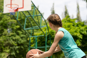 Girl about to shoot basketball