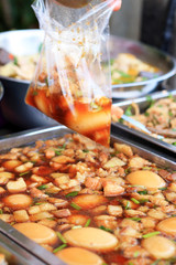 Eggs stewed pork with tofu in market