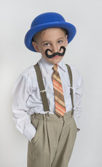 Boy with artificial mustache