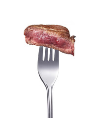 Filetsteak medium auf einer Gabel