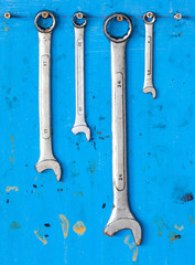 Kit of adjustable grunge metallic screw wrench with dirty blue b