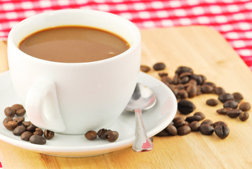Coffee beans and coffee mug