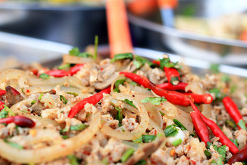 Thai Spicy minced meat salad in market