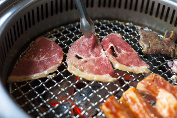 closeup of meat on a grill or barbecue