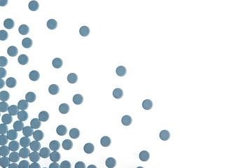 Blue pills background isolated on white