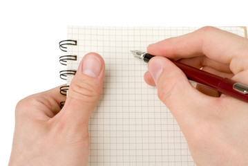 Hand writing on empty notepad (notebook) isolated on white