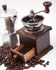 Isolated coffee bean grinder and moka pot