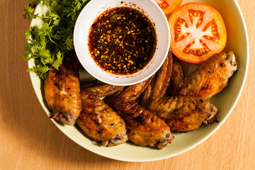 Grilled chicken wings on dish.