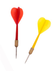 Red and yellow plastic darts on white background - target