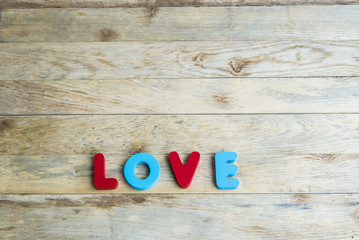 Colorful wooden word Love on wooden floor4