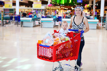Mother and son in supermarket