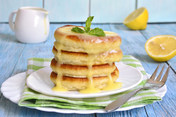 Pancakes with lemon sauce.