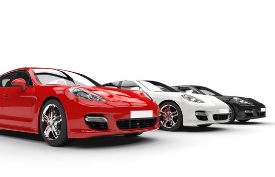 Three modern fast cars in a row, side angle view