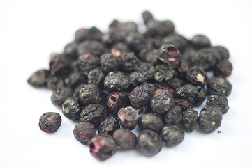 Freeze dried blueberries on a white background.