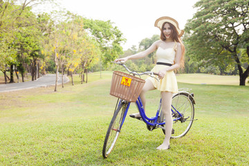 Asian woman riding a bicycle