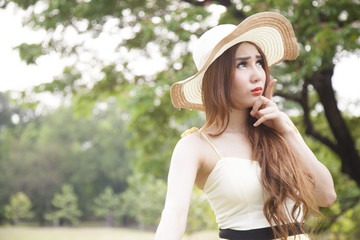 Woman relaxing in the park during the holidays.